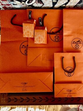 Lot of 4 Hermes Bags  2 small boxes, magazine, 5 lots of ribbons plus chanel